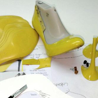 Brown leather cutting with precision tools - Kendrick manufacturing process
